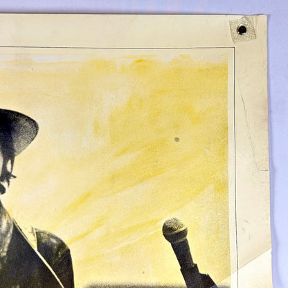 Top right corner of poster with crease and edge wear.