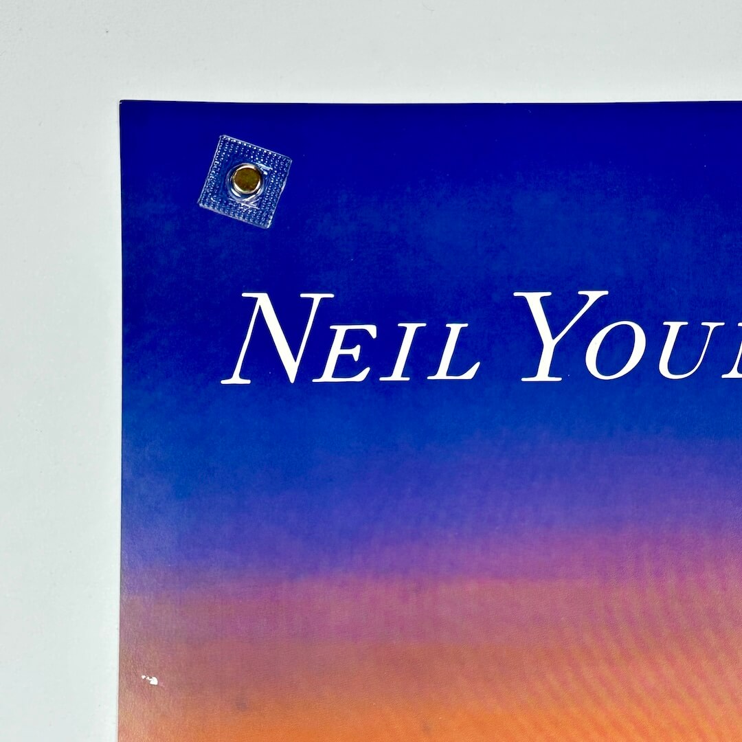 Album cover with 'Neil Young' text on a blue and orange gradient background