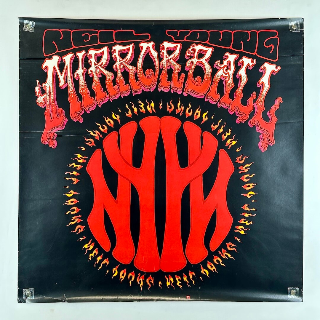 Promo poster for Neil Young with red, flaming graphic under stylized text for album name. 