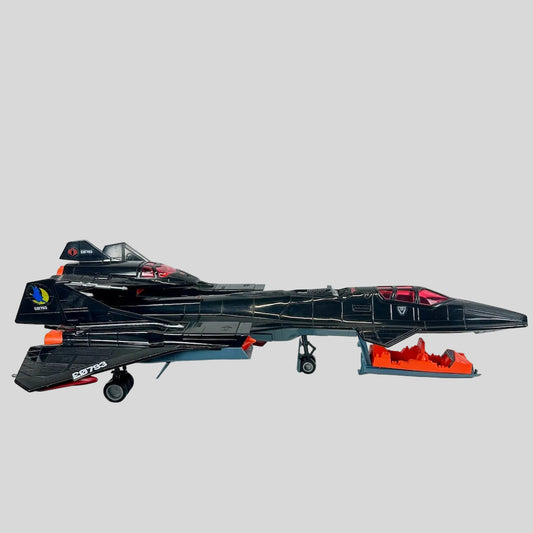 Toy model of a black jet with orange accents on a white background