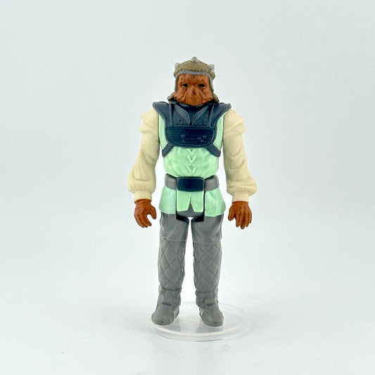 Action figure with a green vest and gray pants on a white background
