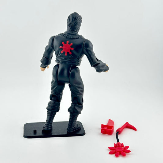 Action figure with a red symbol on a white background