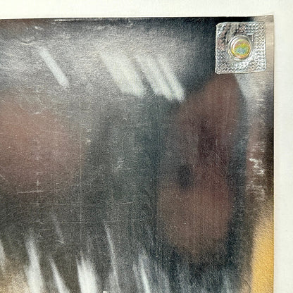 Top right corner in good condition, light scratches visible. 