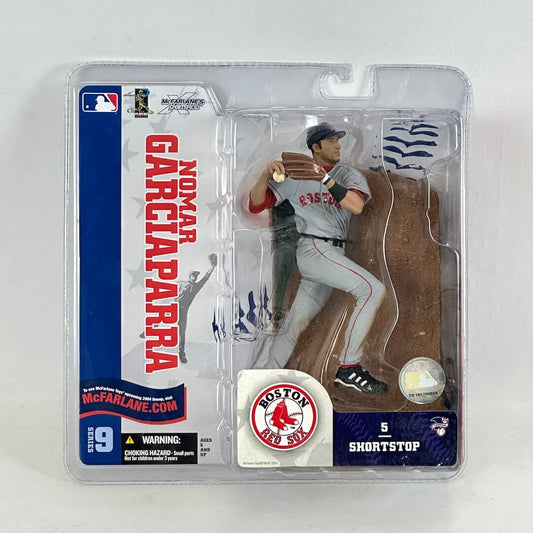 Baseball player action figure in packaging with Boston Red Sox branding