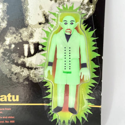 Glowing green figure in a black and yellow package on a white background