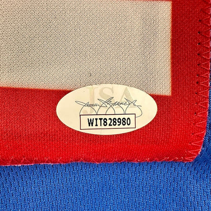 Close-up of a label on a piece of fabric with red, white, and blue colors.