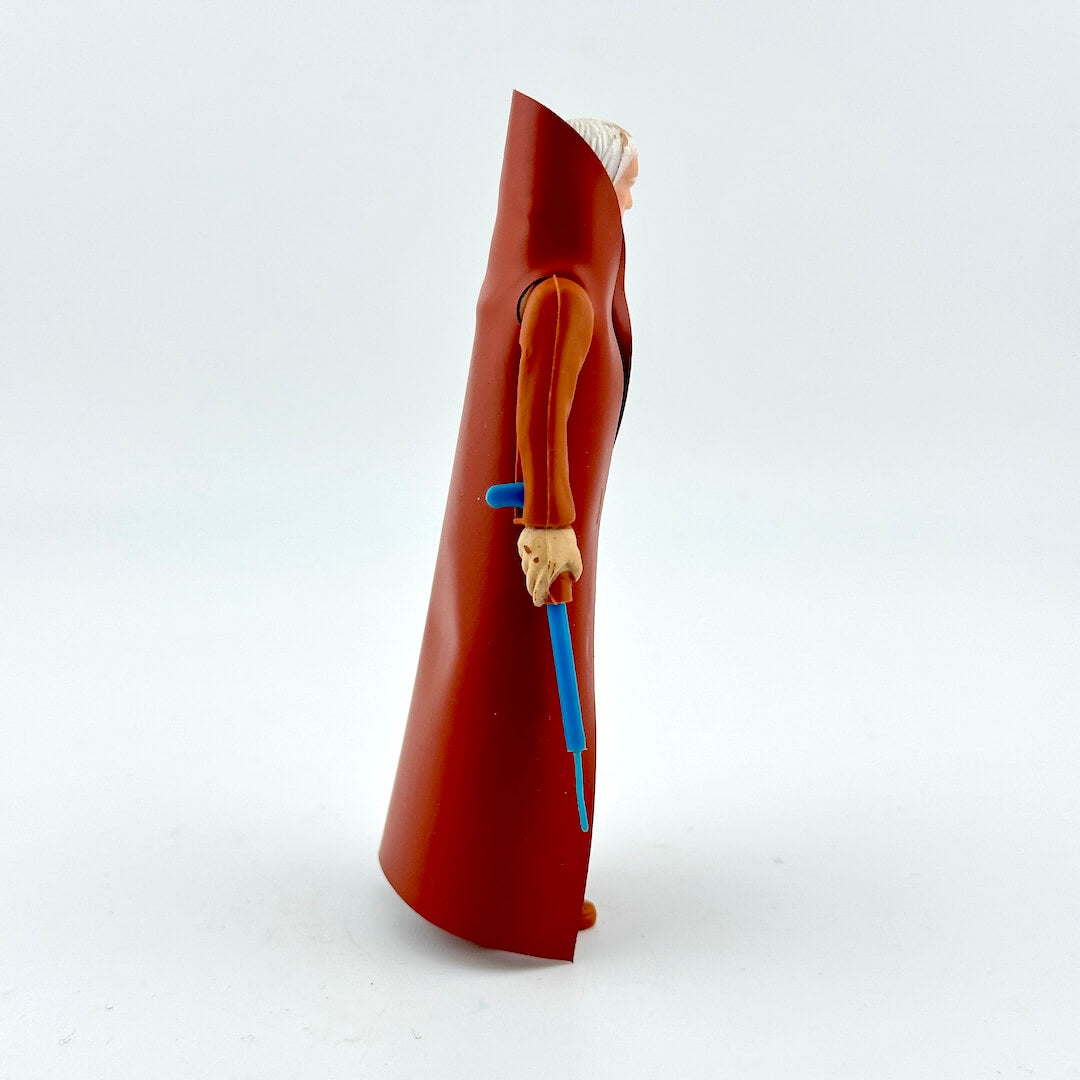 Figurine of a character in a red robe holding a blue sword on a white background