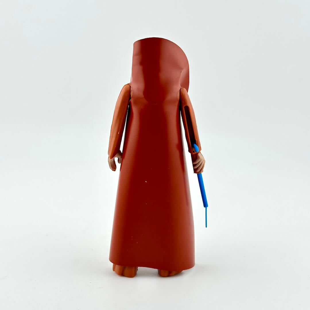 Figure in a long brown robe holding a blue staff on a white background