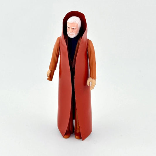 Action figure in a long brown robe on a white background
