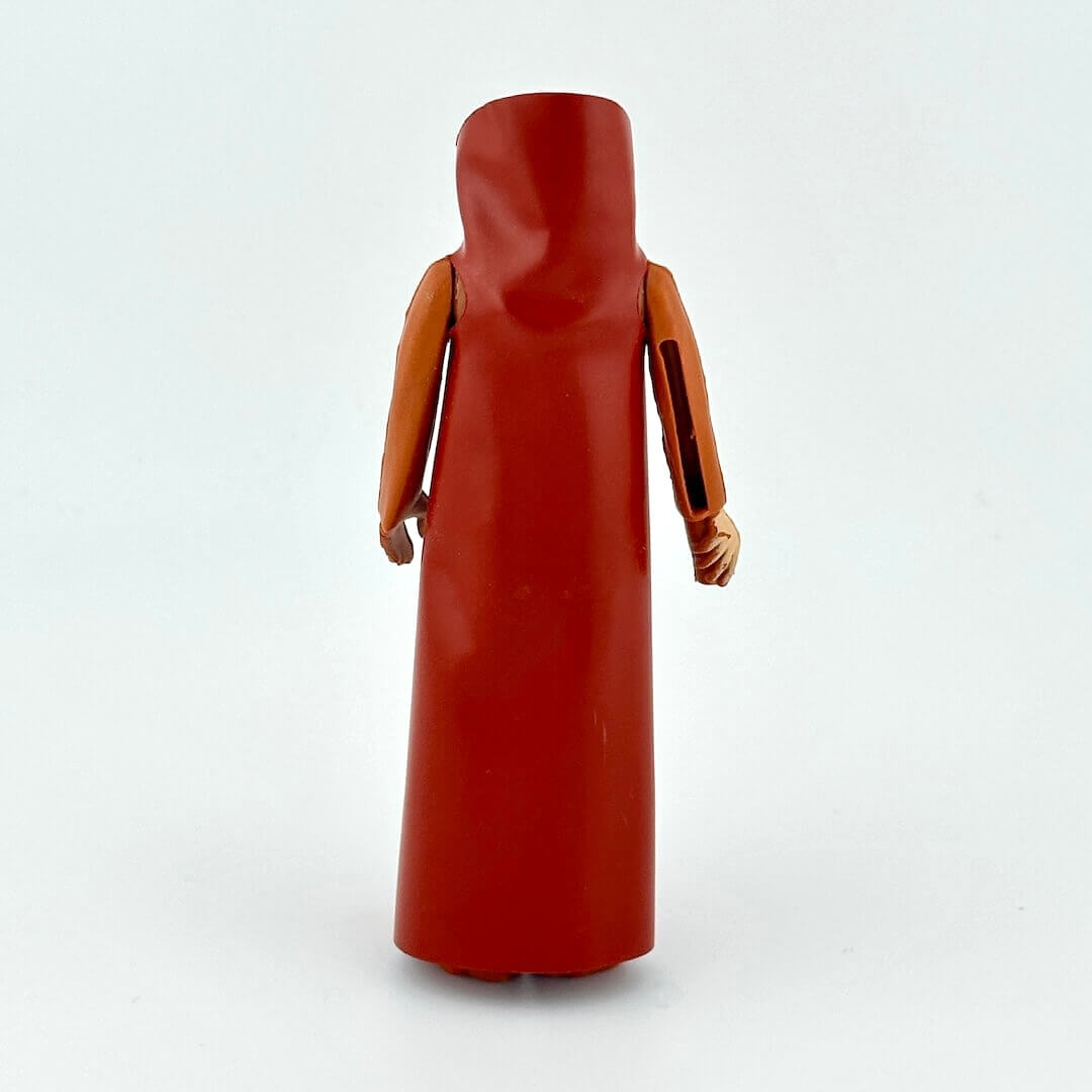 action figure in long brown robe on a white background