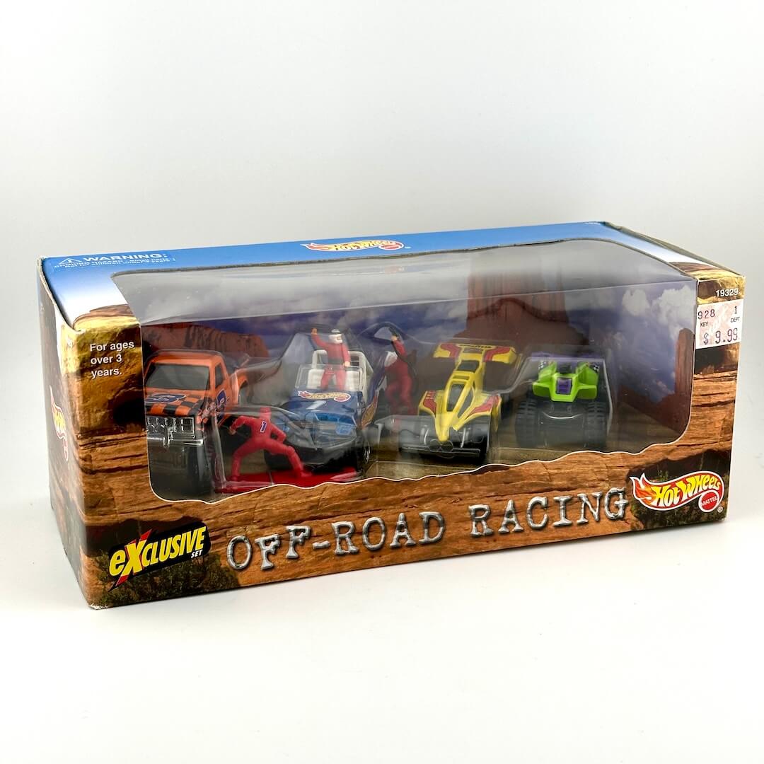 Hot Wheels Exclusive Off-Road Racing toy set in its original retail packaging, featuring four colorful die-cast cars. 