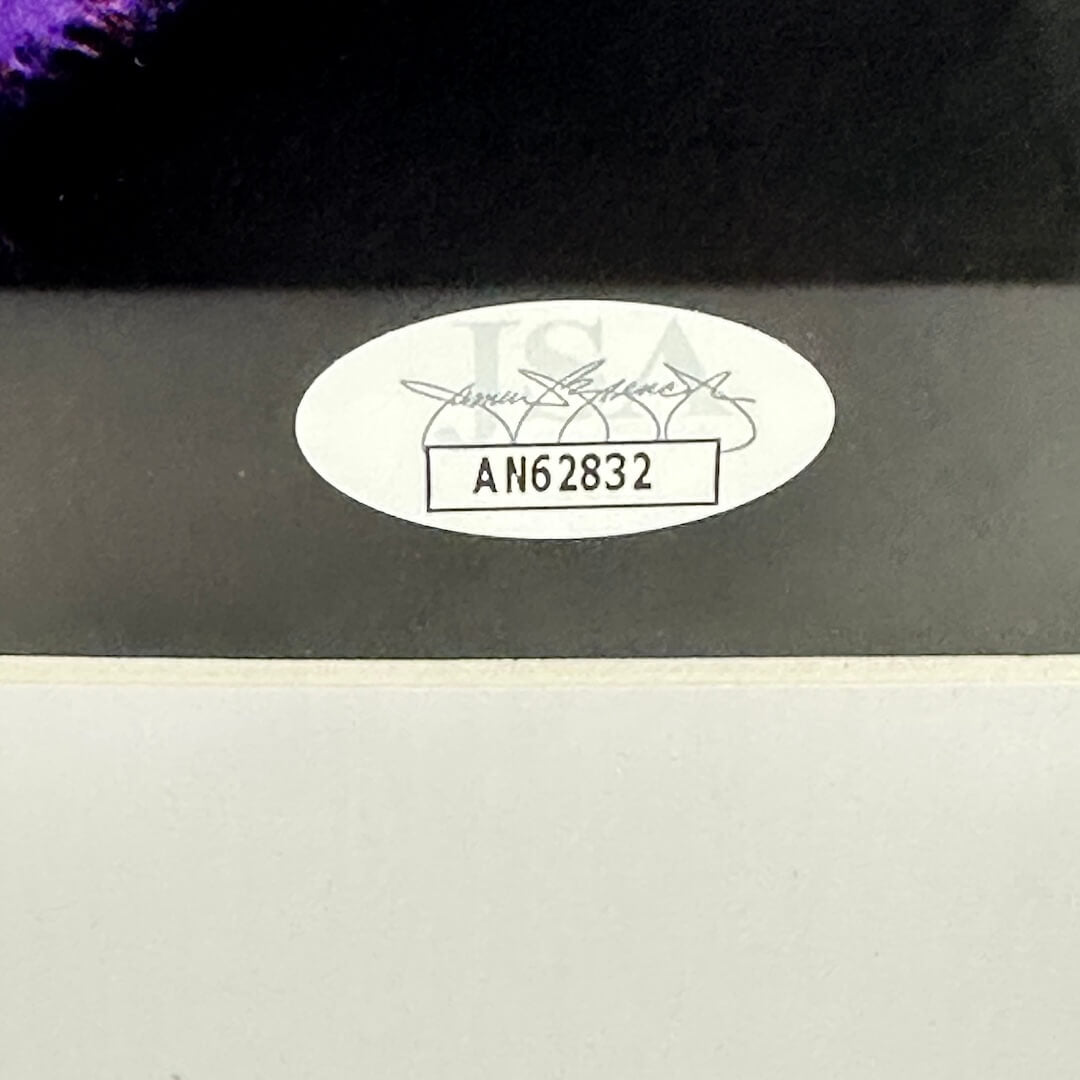 Authentication label with number 'AN62832' on a dark background