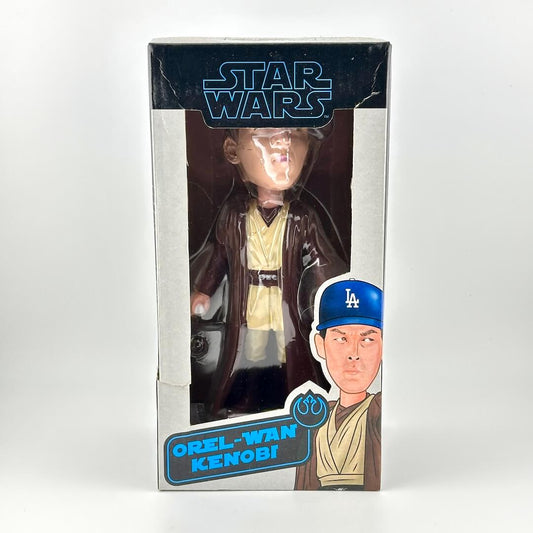 Boxed toy figure of a character inspired by Star Wars, with a baseball cap and Los Angeles Dodgers logo.