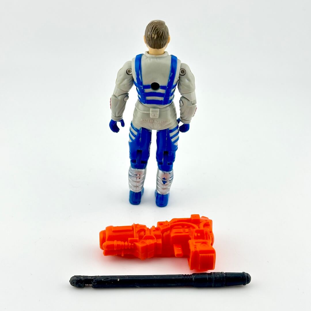 GI Joe action figure in gray and blue flight suit with red accents, pictured with two accessories on white background. 