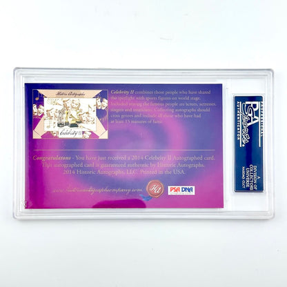 Autograph card with purple background  in protective plastic case against white background. 