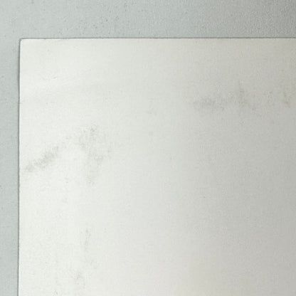Top left corner of poster where there is some unnoticeable damage. 