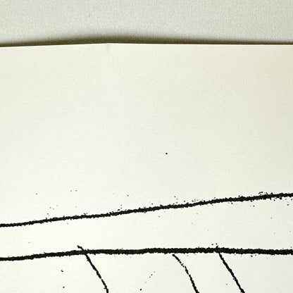Close-up of crease at top center of poster. 