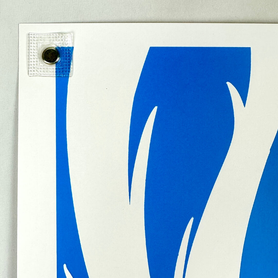 Top left corner of poster with no visible damage. 