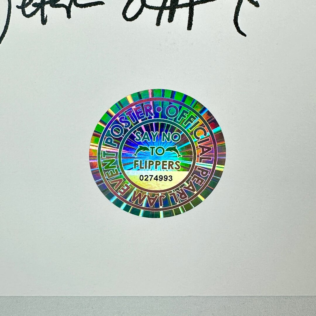 Colorful circular sticker with text on a white background