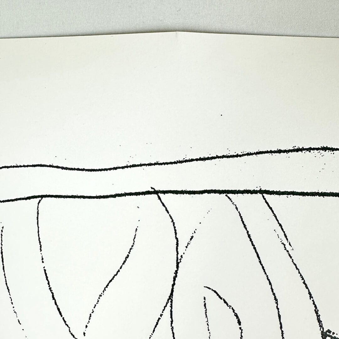 View of slight crease at top of poster. 