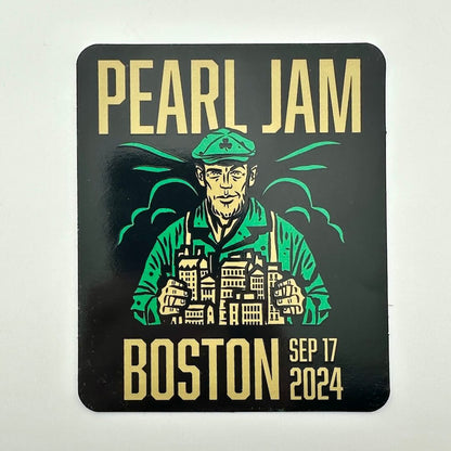 Pearl Jam concert poster with a stylized illustration of a person wearing a green cap and jacket, set against a black background.
