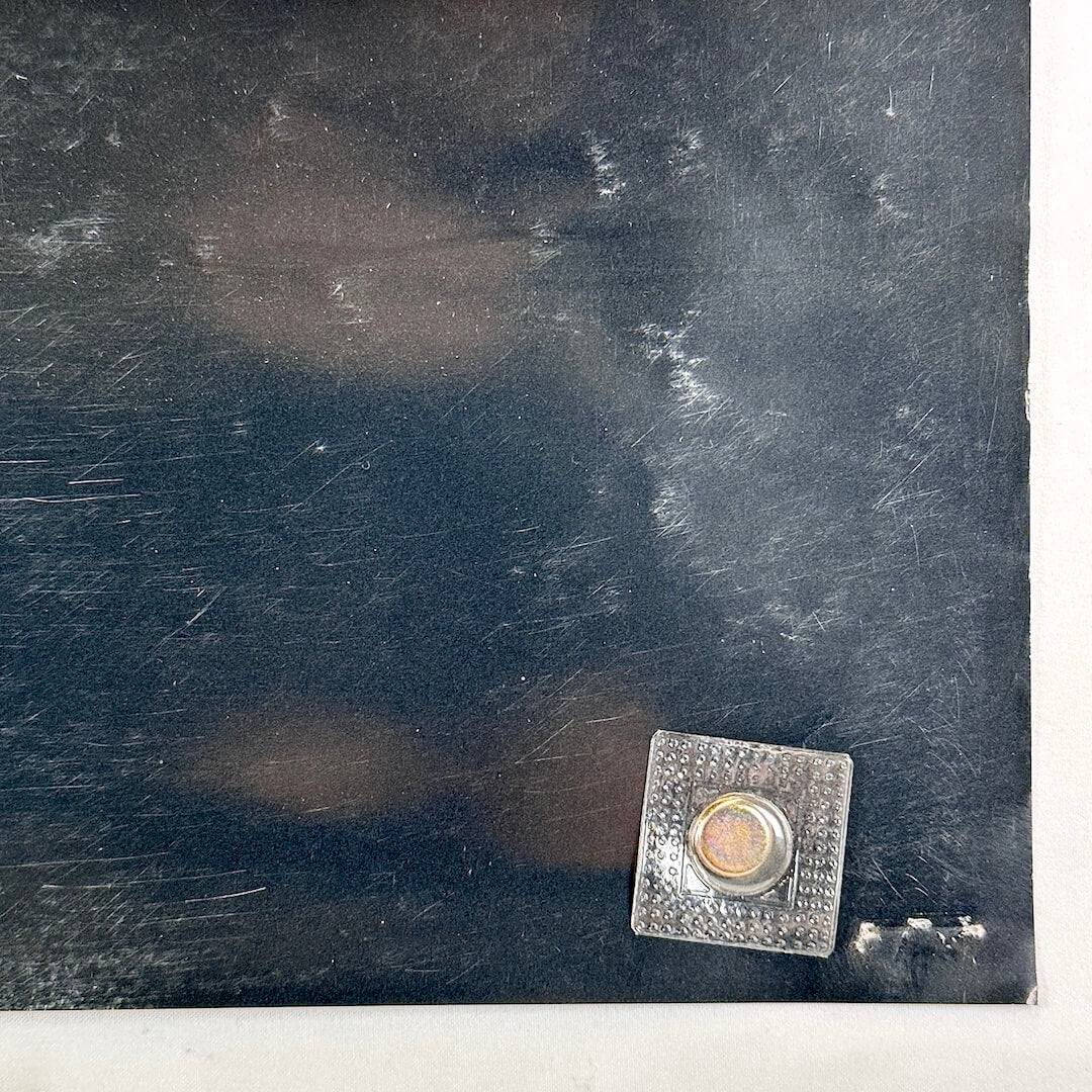 Bottom right corner with scratches and pin holes.