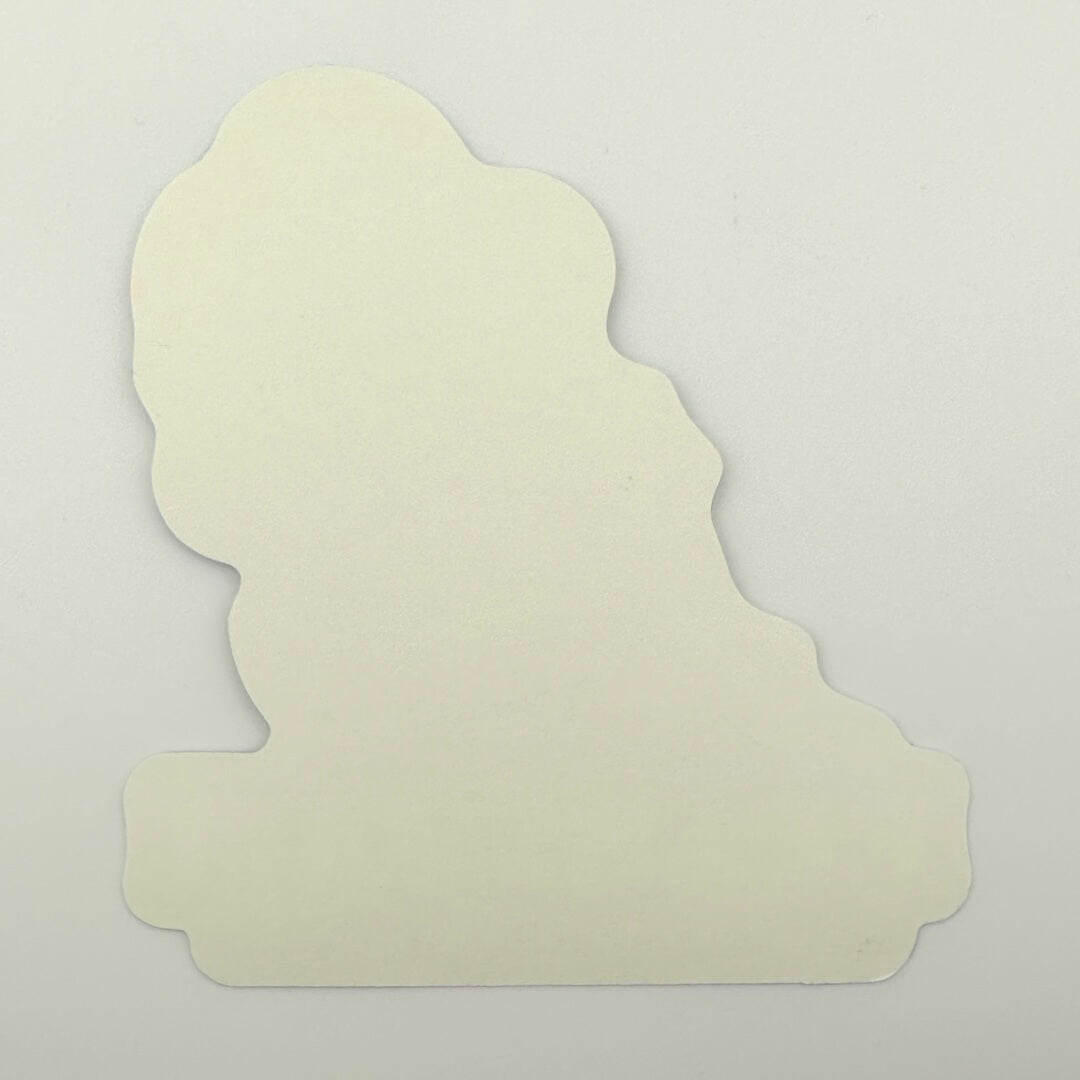 Backside of unused sticker against gray background. 