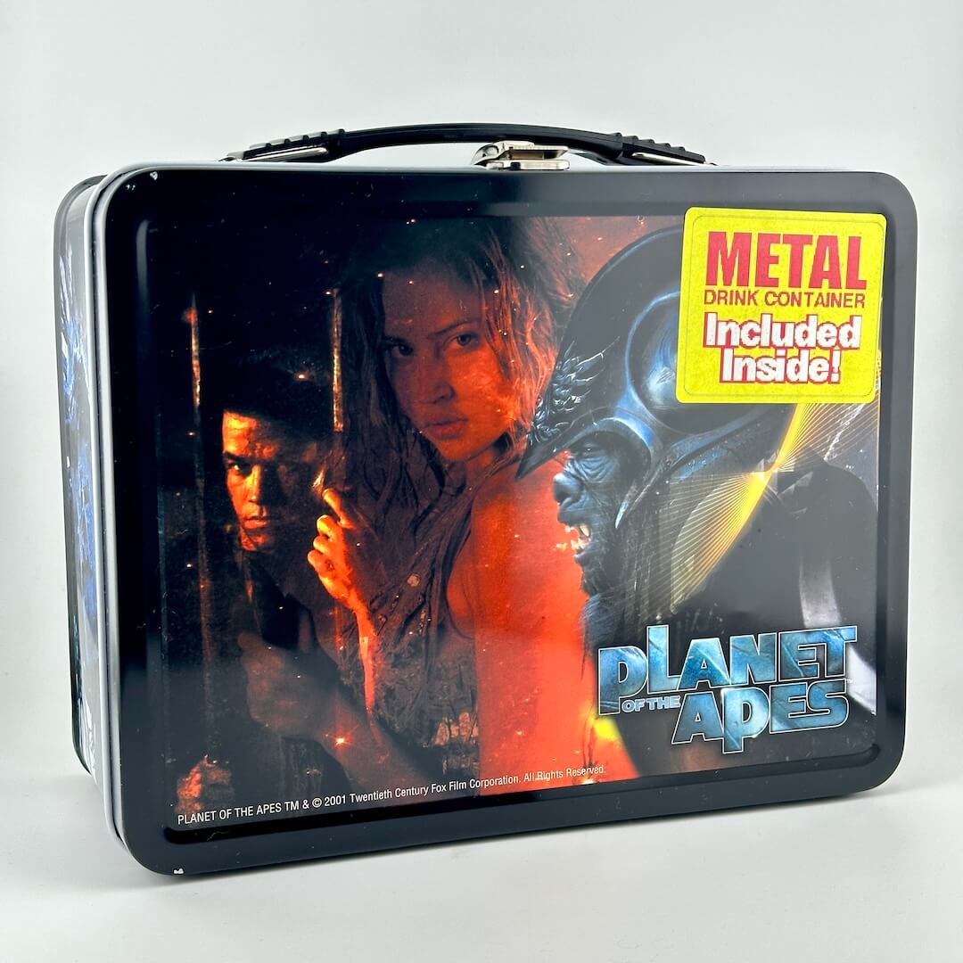 Metal lunchbox with black border and images of characters from the modern Planet of the Apes franchise. 
