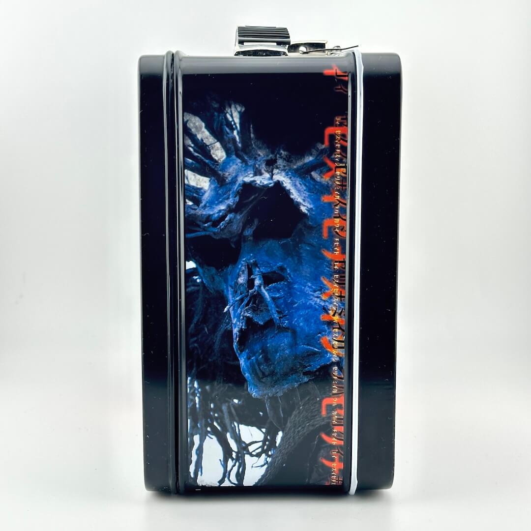 Side view of metal lunchbox with black border and imagery from latest Planet of the Apes movie. 
