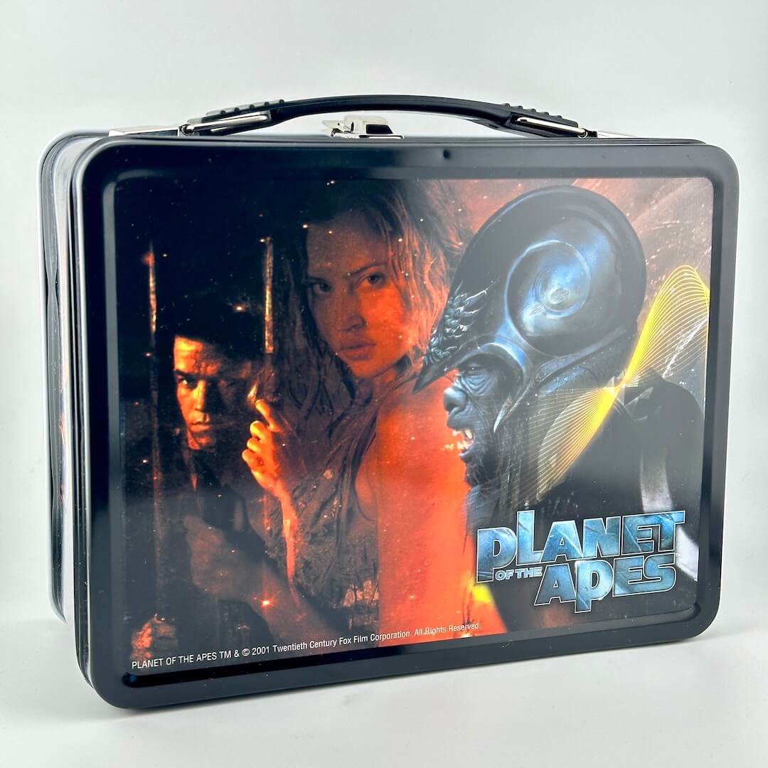 Metal lunchbox with black border and images of characters from the modern Planet of the Apes franchise. 