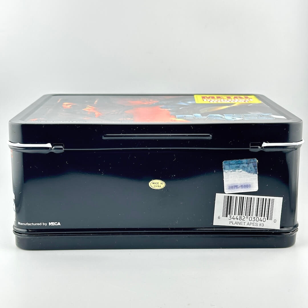 Bottom of metal lunchbox showing barcode and holographic sticker and made in china sticker. 