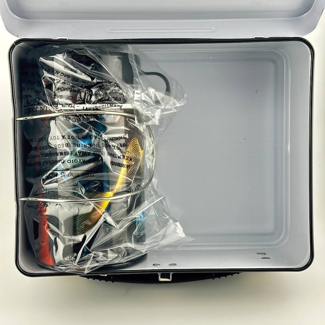 Interior of lunchbox showing matching thermos in original plastic. 