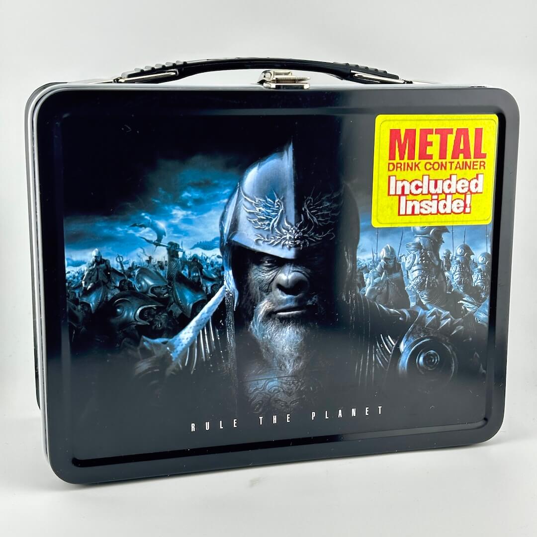 Planet of the Apes lunchbox with image of armored apes, photographed on gray background. 