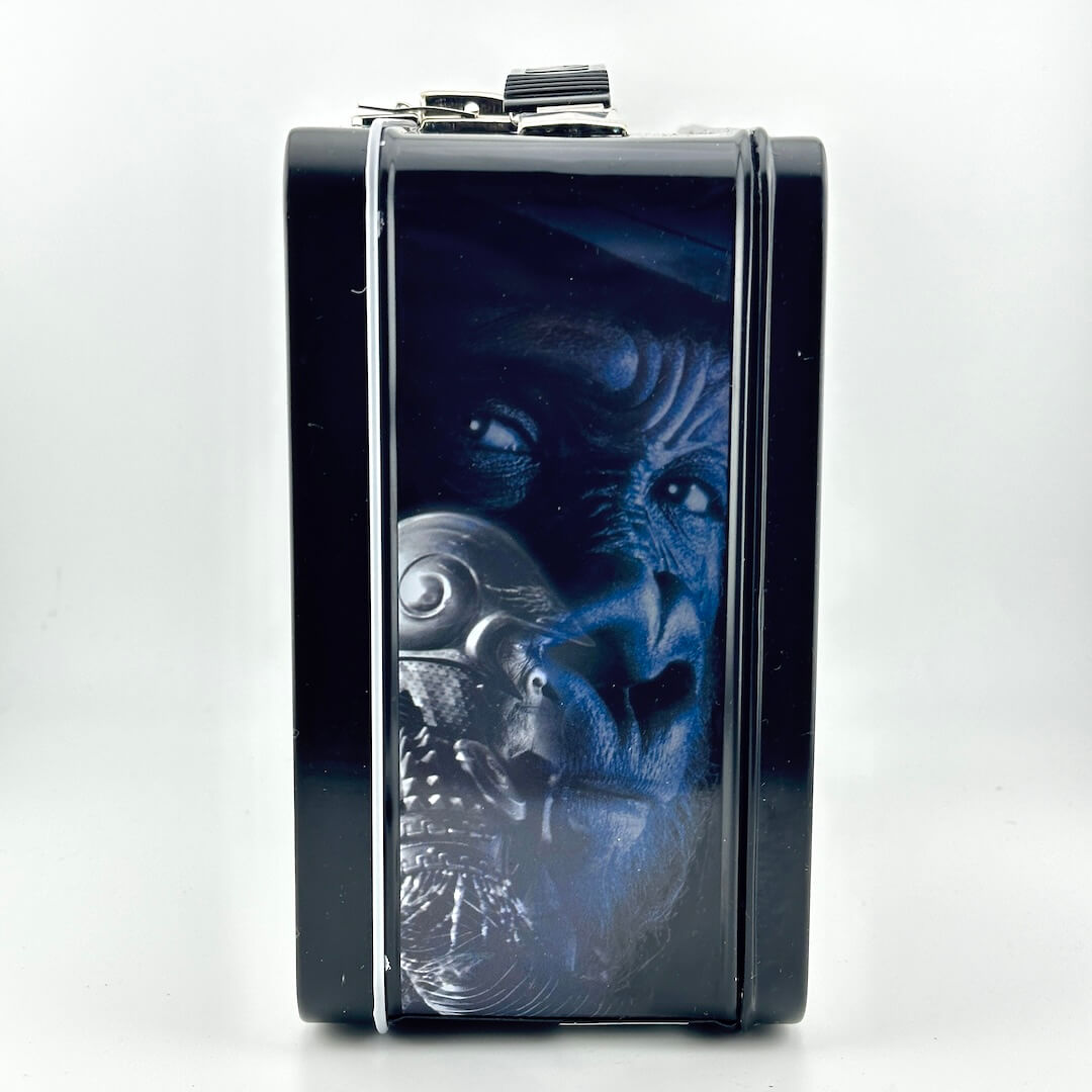 Side view of metal lunchbox with image of armored ape from Planet of the Apes. 