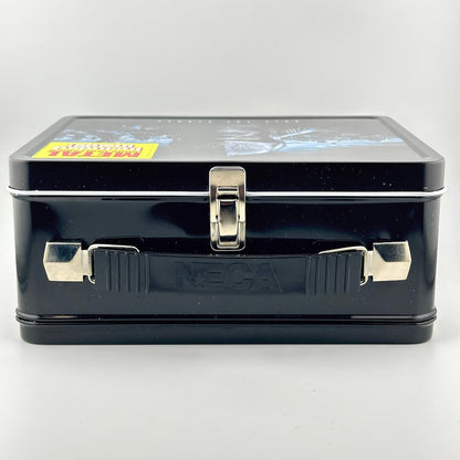 Top view of lunchbox with silver latch and black plastic handle. 