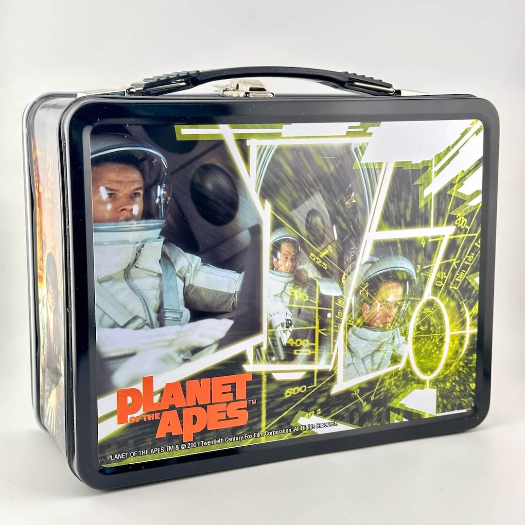 Metal lunchbox with black border and plastic handle with image of Mark Wahlberg from Planet of the Apes. 