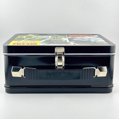 Top view of metal lunchbox showing black plastic handle, silver latch, and handle attachments. 
