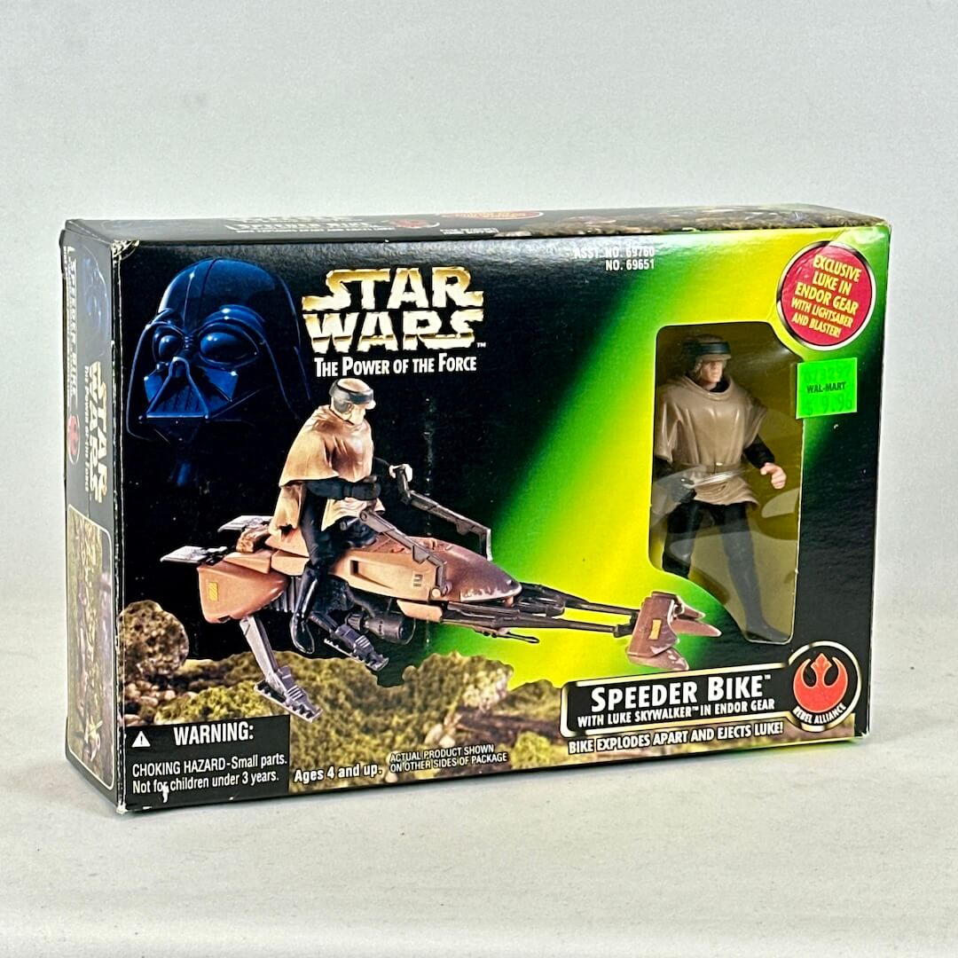Star Wars toy box with figures and speeder bike on a white background
