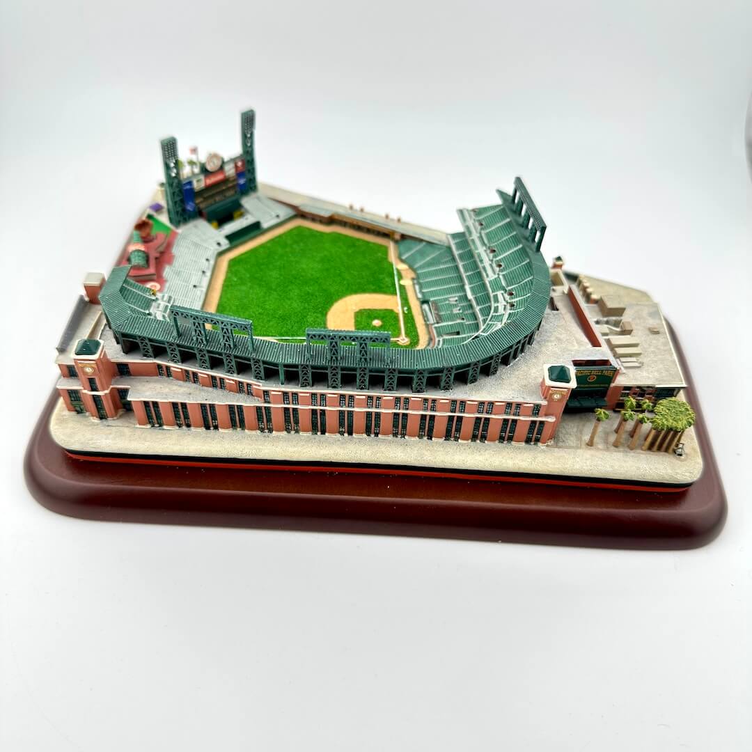Model of a baseball stadium on a wooden base with a white background