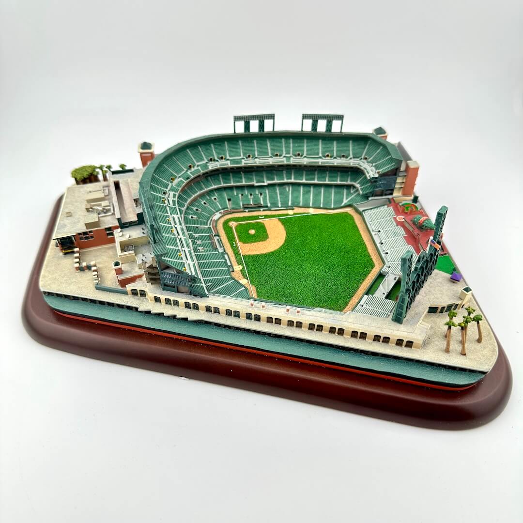 Model of a baseball stadium on a wooden base with a white background