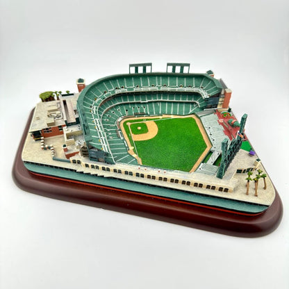 Model of a baseball stadium on a wooden base with a white background