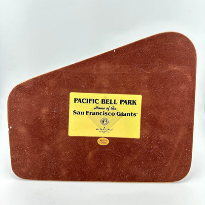 Brown leather base to replica with a gold label describing replica as Pacific Bell Park, home of the San Francisco Giants.