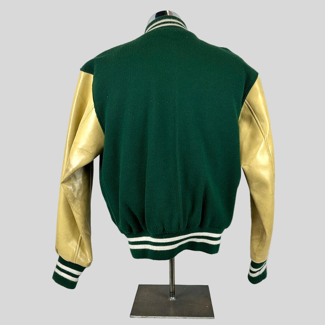 Green and gold varsity jacket on a mannequin against a white background