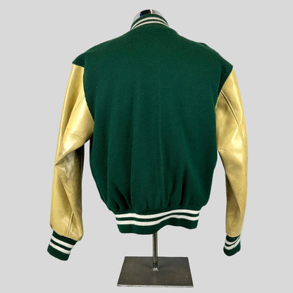 Green and gold varsity jacket on a mannequin against a white background