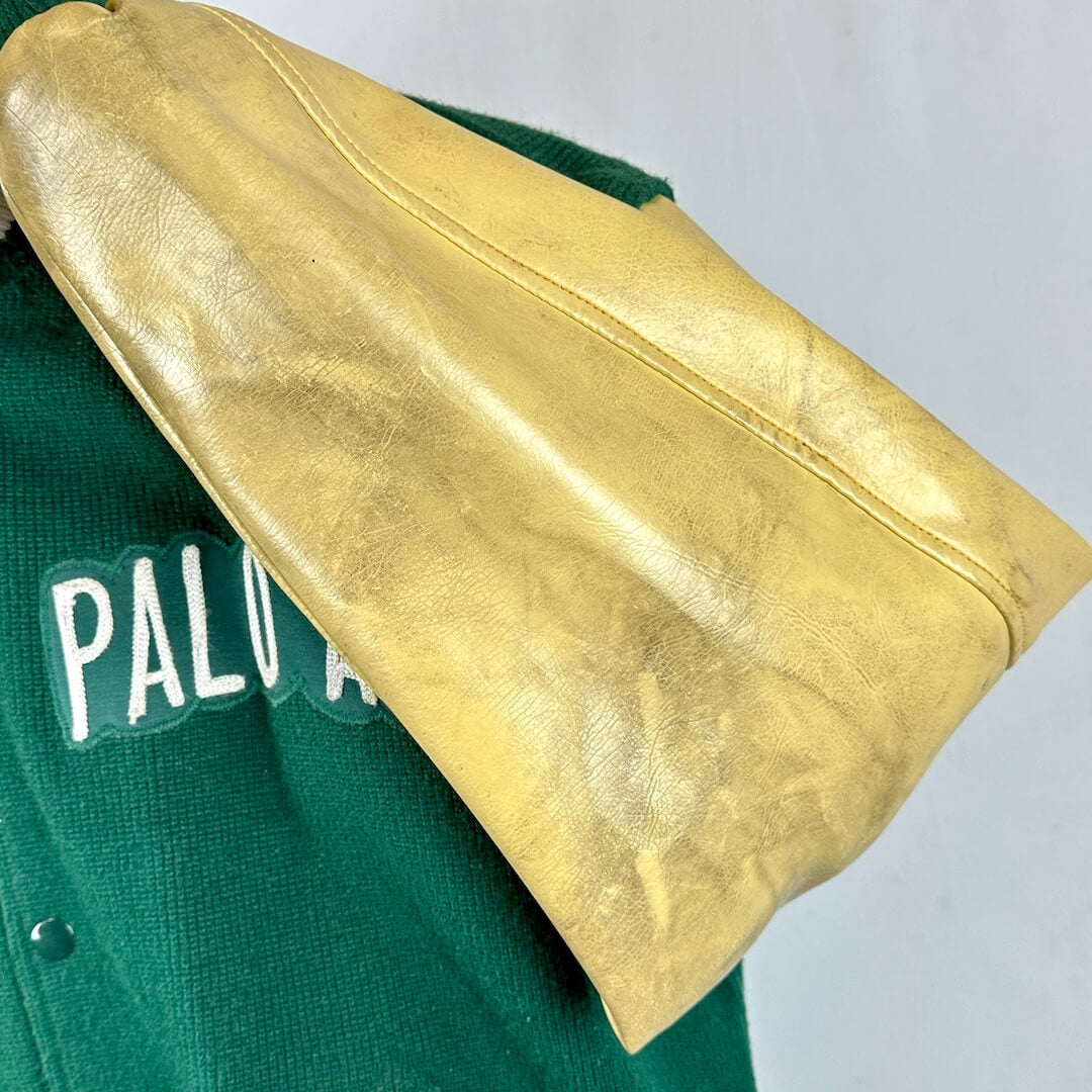 Green and gold letterman varsity jacket with leather sleeves with some condition issues. 