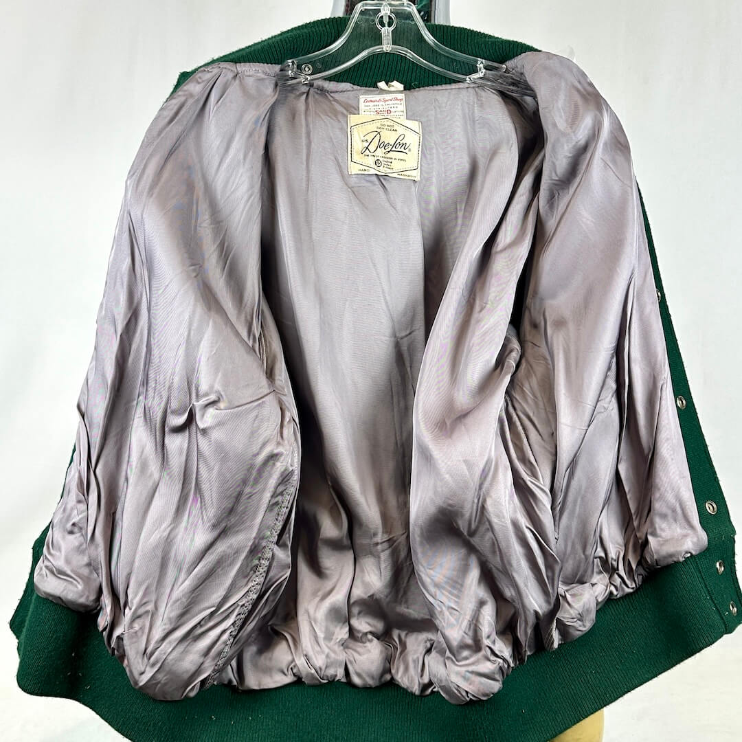 Interior of green and gold varsity jacket