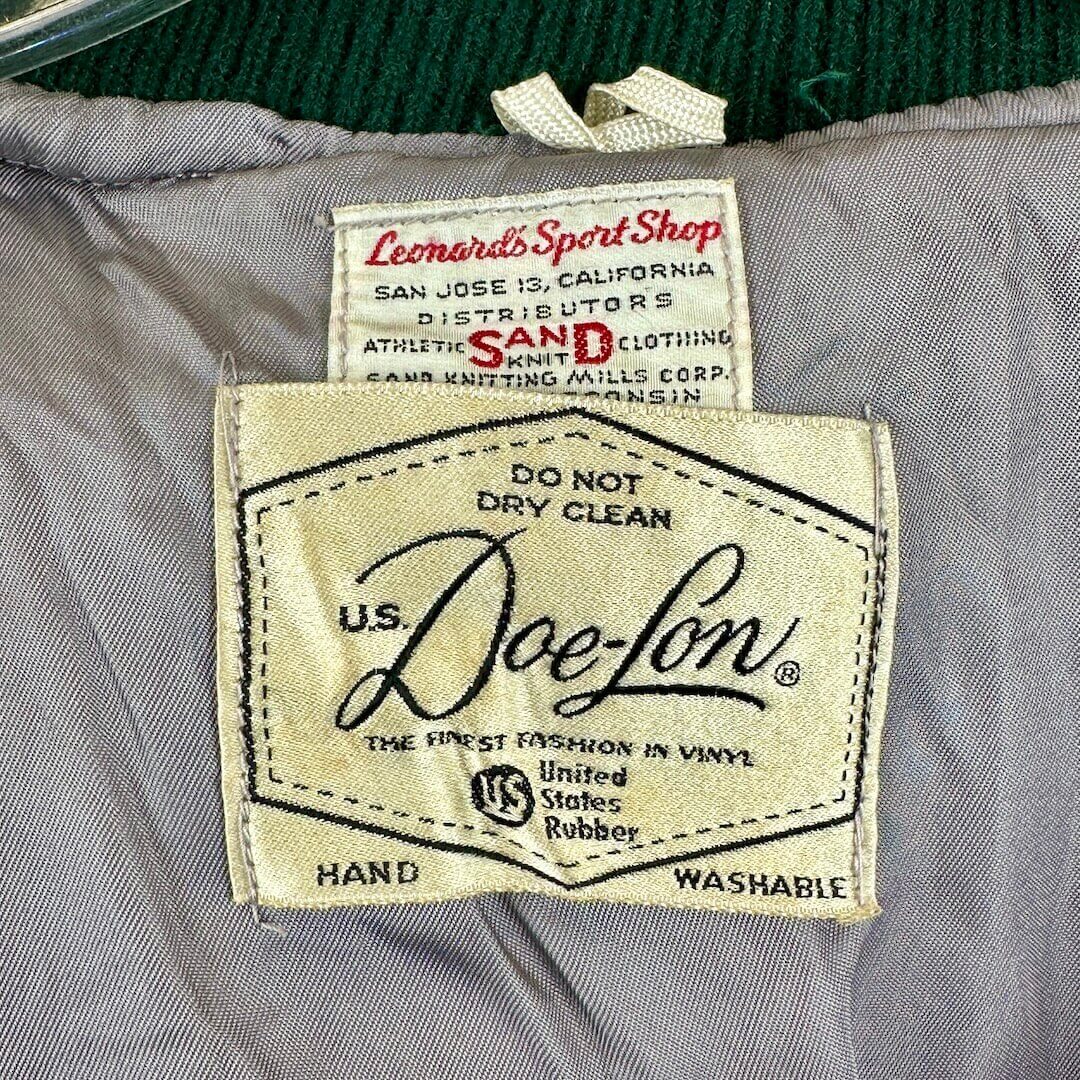 Close-up of U.S. Doe-Lon label on a garment with additional labels above it.
