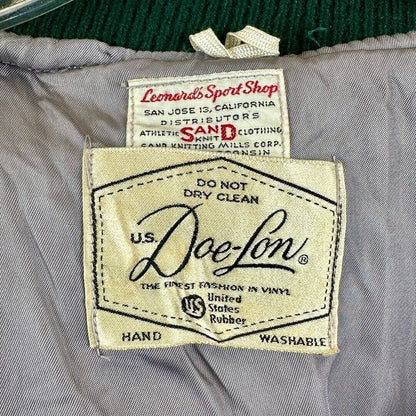 Close-up of U.S. Doe-Lon label on a garment with additional labels above it.