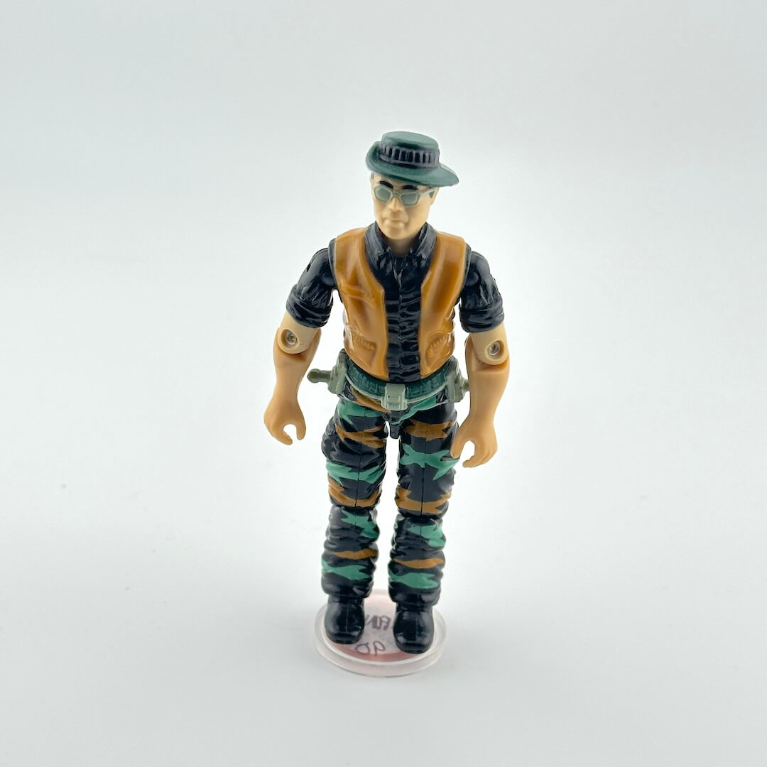 G.I. Joe action figure in military attire against white background. 