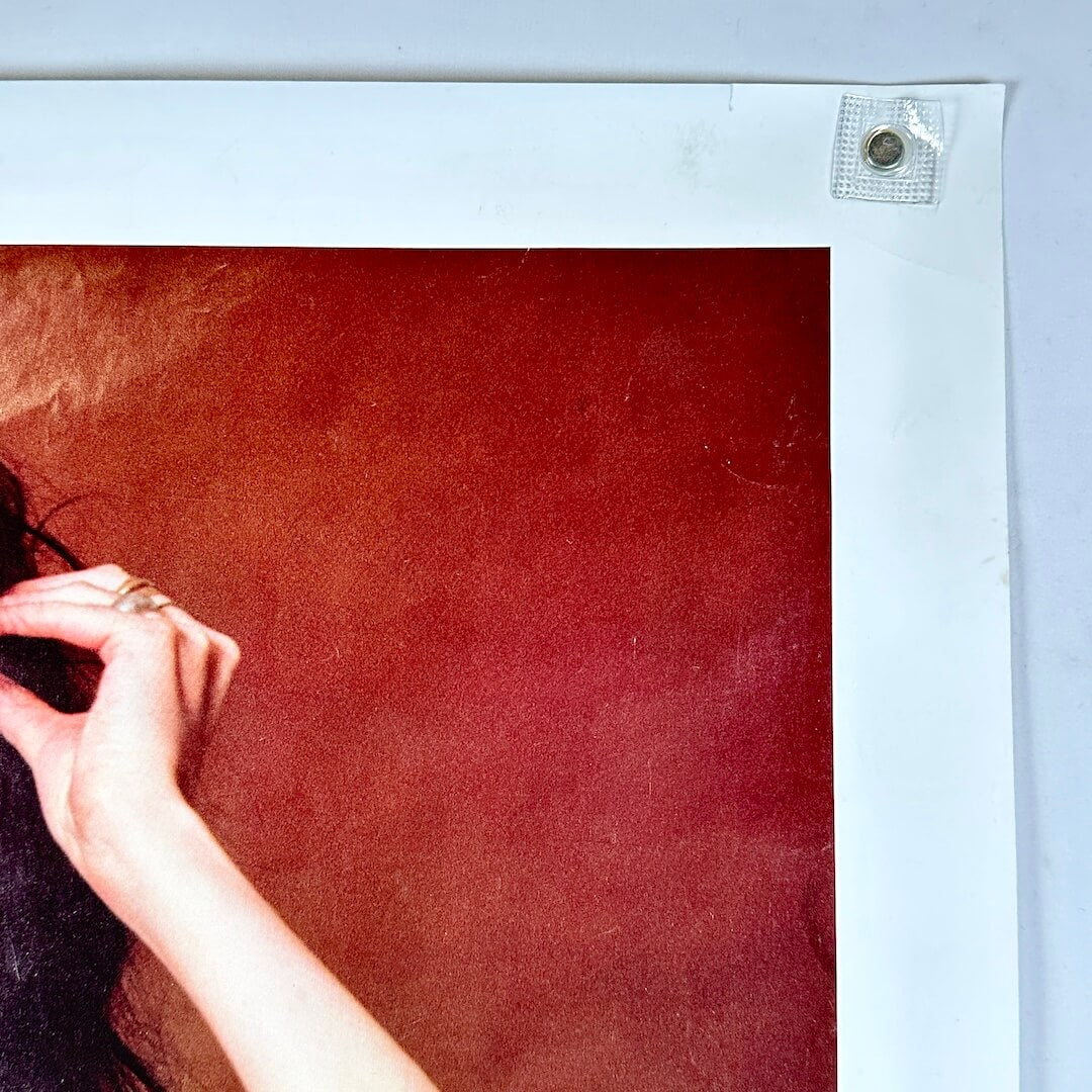 Top right corner with small tear three inches to the left of corner.